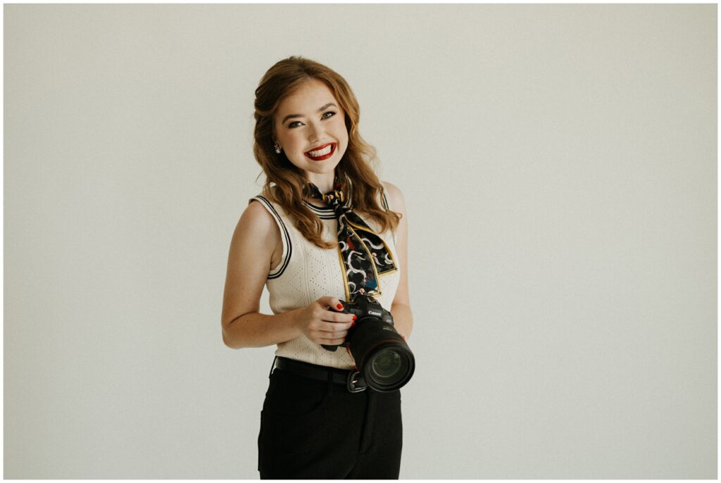 photograph of wedding photographer holding camera