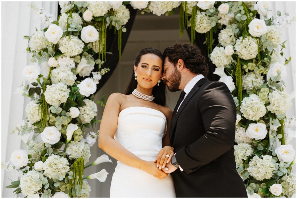 a bride and groom embrace
